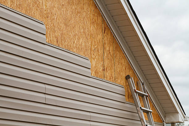 Professional Storm Damage Siding Repair technician working in Pineville, NC